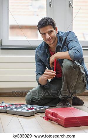 Portrait of a technician smiling View Large Photo Image Stock Photo - Portrait of a technician smiling. Fotosearch