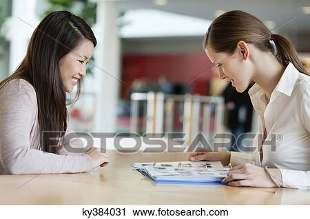 Businesswomen working in an office View Large Photo Image Stock Image - Businesswomen working in an office. Fotosearch