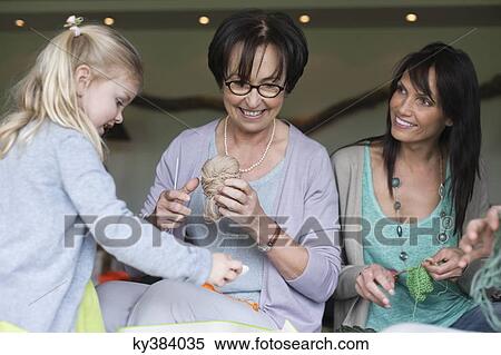 Girl learning knitting with her mother and grandmother View Large Photo Image Stock Photography - Girl learning knitting with her mother and grandmother. Fotosearch