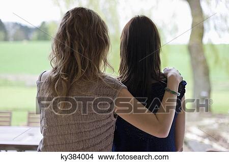 Rear view of a woman with her mother View Large Photo Image Picture - Rear view of a woman with her mother. Fotosearch