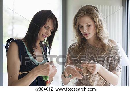 Two women knitting View Large Photo Image Stock Image - Two women knitting. Fotosearch