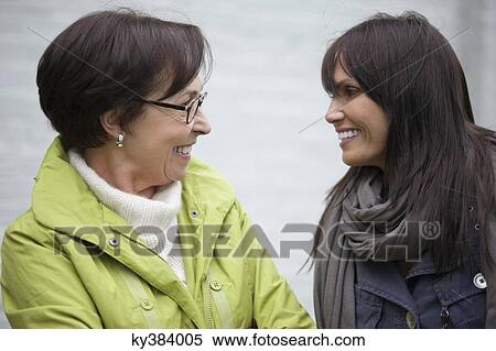 Two women talking to each other View Large Photo Image Stock Photography - Two women talking to each other. Fotosearch