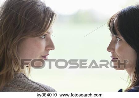 Stock Image - Woman and her mother face to face. Fotosearch