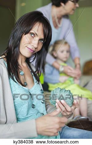 Woman holding a ball of wool View Large Photo Image Stock Photo - Woman holding a ball of wool. Fotosearch