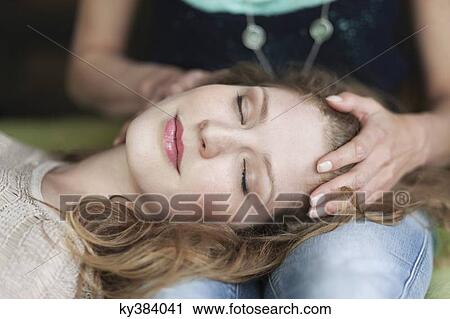Woman lying on her mother's lap View Large Photo Image Stock Image - Woman lying on her mother's lap. Fotosearch