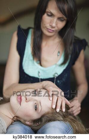 Woman lying on her mother's lap View Large Photo Image Stock Photo - Woman lying on her mother's lap. Fotosearch