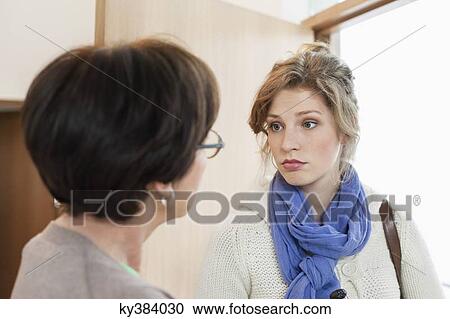 Woman talking to her mother View Large Photo Image Stock Image - Woman talking to her mother. Fotosearch