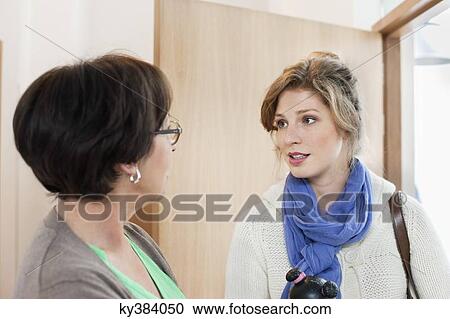 Stock Image - Woman talking to her mother. Fotosearch