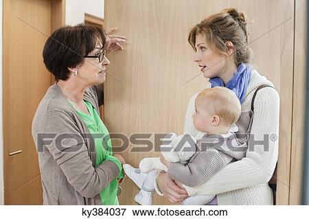 Woman talking to nanny View Large Photo Image Stock Photo - Woman talking to nanny. Fotosearch