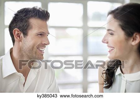 Stock Image - Close-up of a couple smiling. Fotosearch