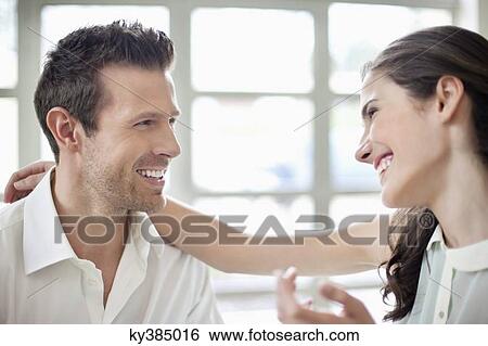 Stock Photograph - Close-up of a couple smiling. Fotosearch