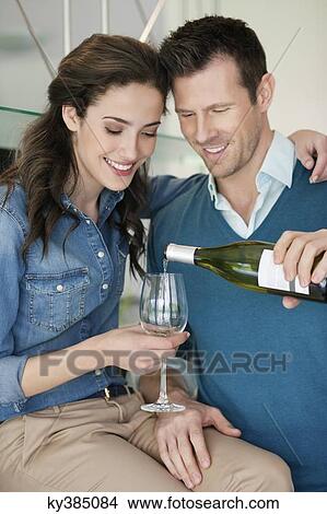 Couple drinking wine in the kitchen View Large Photo Image Picture - Couple drinking wine in the kitchen. Fotosearch
