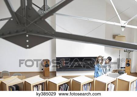 Couple in a studio apartment View Large Photo Image Stock Photo - Couple in a studio apartment. Fotosearch