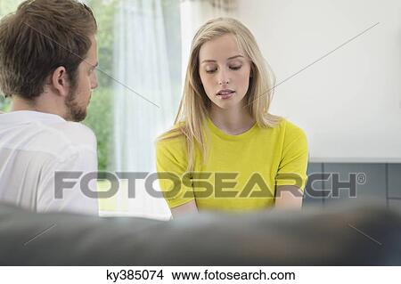Couple sitting together View Large Photo Image Picture - Couple sitting together. Fotosearch
