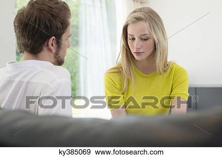 Couple sitting together View Large Photo Image Stock Photo - Couple sitting together. Fotosearch