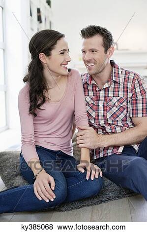 Stock Photo - Couple smiling at each other. Fotosearch