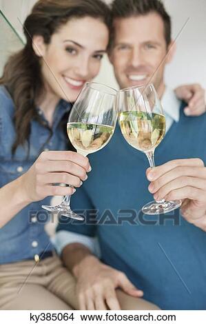 Couple toasting with wine View Large Photo Image Picture - Couple toasting with wine. Fotosearch