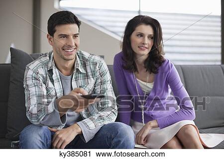 Stock Image - Couple watching television. Fotosearch