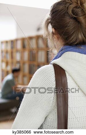 Stock Photograph - Rear view of a woman. Fotosearch