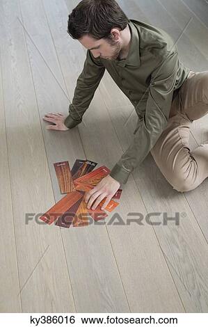 High angle view of a man choosing laminate boards View Large Photo Image Stock Photograph - High angle view of a man choosing laminate boards. Fotosearch