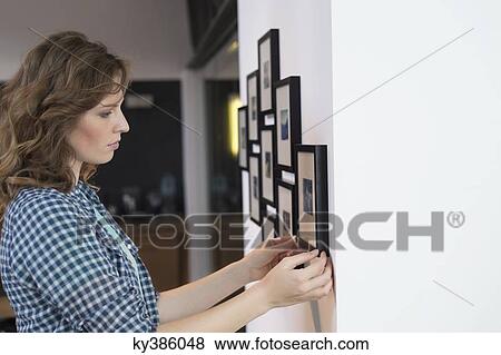 Interior designer measuring painting size View Large Photo Image Stock Photo - Interior designer measuring painting size. Fotosearch
