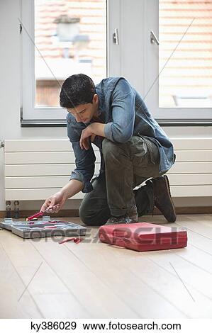 Technician arranging his toolbox View Large Photo Image Stock Photo - Technician arranging his toolbox. Fotosearch