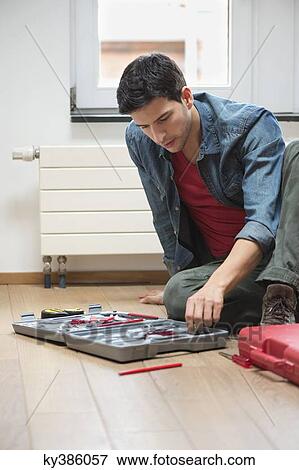 Technician arranging his toolbox View Large Photo Image Stock Photo - Technician arranging his toolbox. Fotosearch