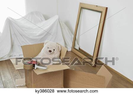Teddy bear in a cardboard box View Large Photo Image Stock Photo - Teddy bear in a cardboard box. Fotosearch