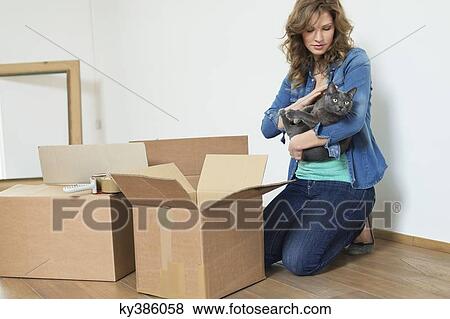 Woman with her cat View Large Photo Image Stock Photo - Woman with her cat. Fotosearch