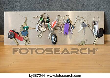 Assorted keys on a metal sheet View Large Photo Image Picture - Assorted keys on a metal sheet. Fotosearch