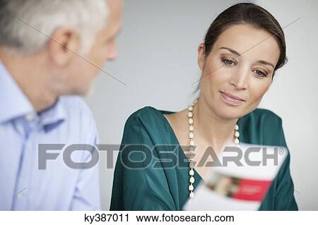 Business executives discussing in an office View Large Photo Image Stock Image - Business executives discussing in an office. Fotosearch