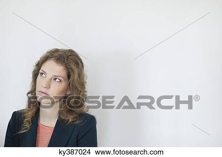 Picture - Close-up of a woman thinking. Fotosearch