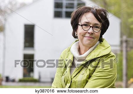 Portrait of a woman smiling View Large Photo Image Stock Photograph - Portrait of a woman smiling. Fotosearch