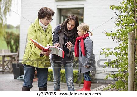 Real estate agent showing woman a property View Large Photo Image Stock Photography - Real estate agent showing woman a property. Fotosearch