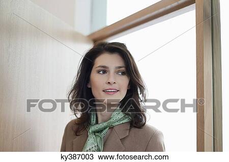 Woman entering a room to discover surprise View Large Photo Image Stock Image - Woman entering a room to discover surprise. Fotosearch
