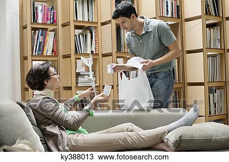 Man giving medicine to his mother View Large Photo Image Stock Image - Man giving medicine to his mother. Fotosearch