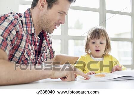Man teaching his daughter View Large Photo Image Stock Image - Man teaching his daughter. Fotosearch