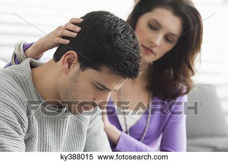 Woman comforting her husband View Large Photo Image Stock Photography - Woman comforting her husband. Fotosearch