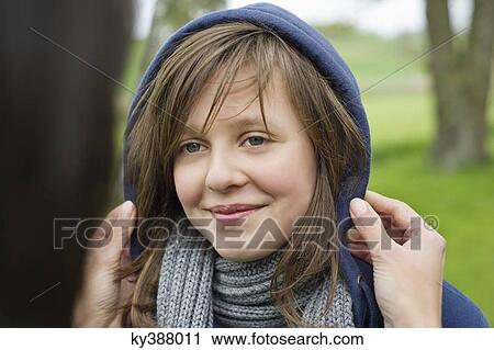 Stock Image - Woman pampering her daughter. Fotosearch