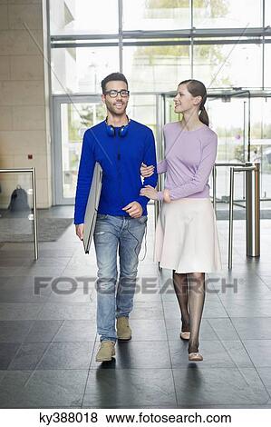 Stock Photo - Young couple walking. Fotosearch