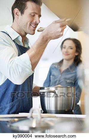 Couple tasting the food View Large Photo Image Picture - Couple tasting the food. Fotosearch