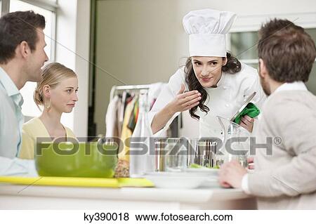Female chef smelling food before serving View Large Photo Image Stock Photo - Female chef smelling food before serving. Fotosearch