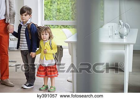 Children with their father leaving for school View Large Photo Image Stock Photo - Children with their father leaving for school. Fotosearch