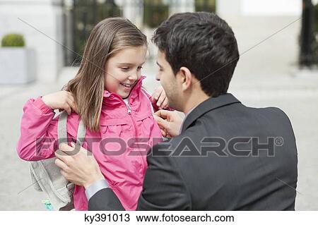 Close-up of a girl with her father View Large Photo Image Stock Image - Close-up of a girl with her father. Fotosearch