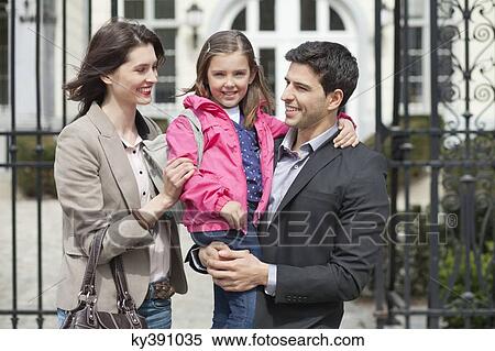 Stock Photography - Close-up of a girl with her parents. Fotosearch
