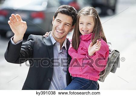 Man and his daughter waving hands View Large Photo Image Stock Photo - Man and his daughter waving hands. Fotosearch