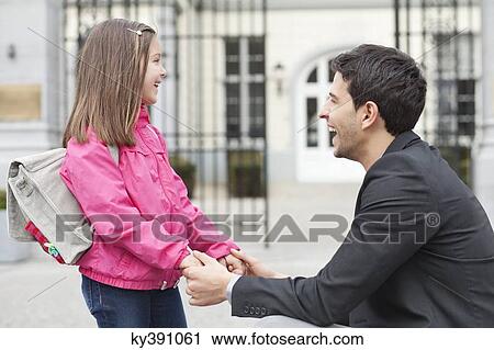 Man talking to his daughter View Large Photo Image Stock Image - Man talking to his daughter. Fotosearch