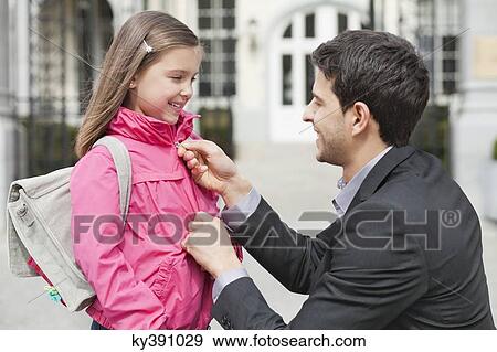 Stock Photo - Man talking to his daughter. Fotosearch