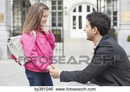 Man talking to his daughter View Large Photo Image Stock Photograph - Man talking to his daughter. Fotosearch