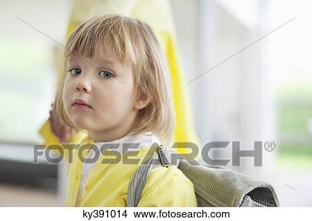 Picture - Portrait of a girl holding hand of her mother. Fotosearch